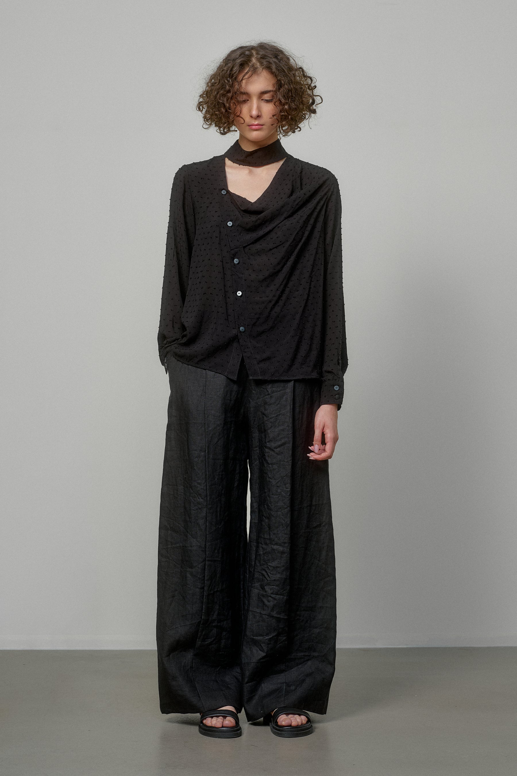 BLACK SHIRT WITH DRAPED FRONT AND HIGH NECK COLLAR