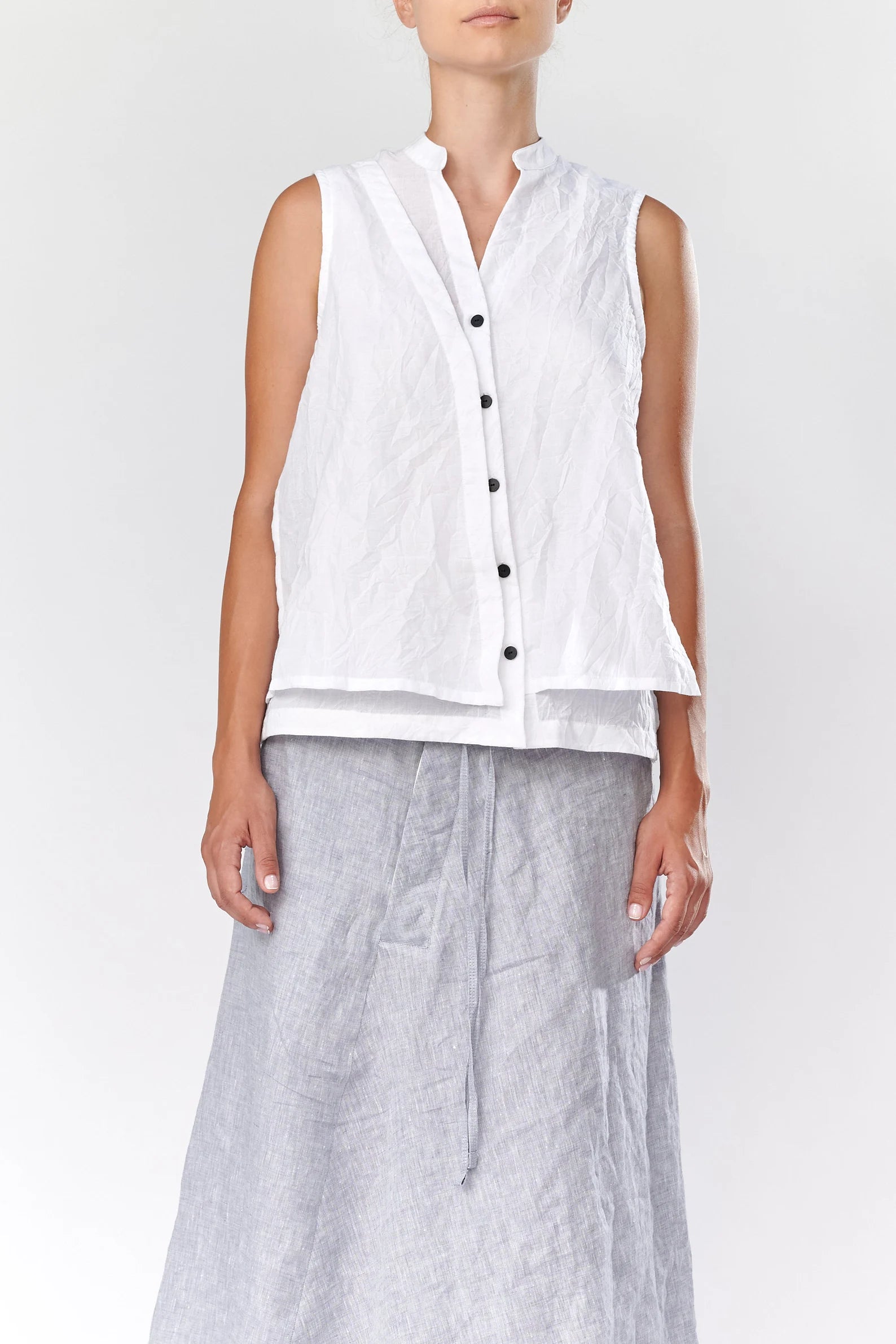 SLEEVELESS COTTON ASYMMETRICAL SHIRT