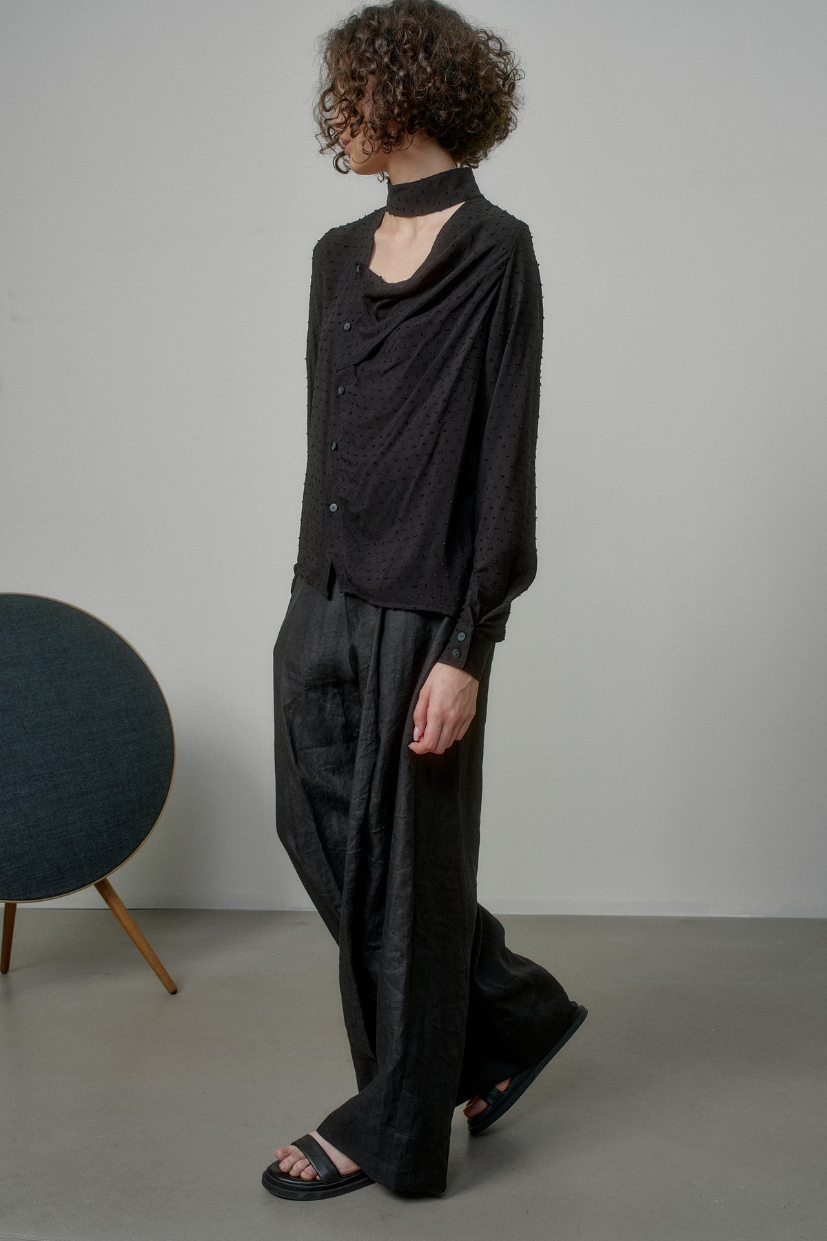 BLACK SHIRT WITH DRAPED FRONT AND HIGH NECK COLLAR